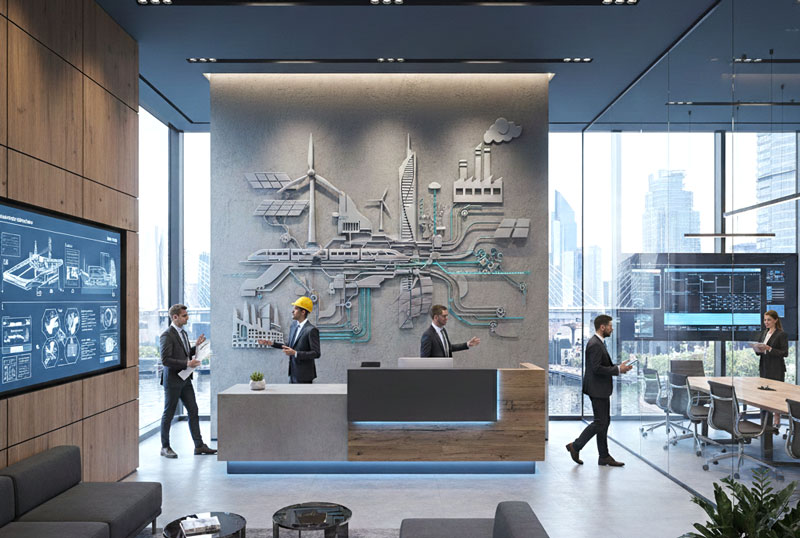 Modern office lobby with a wall relief depicting infrastructure, energy and rail, and professionals in discussion, one of them wearing a hard hat